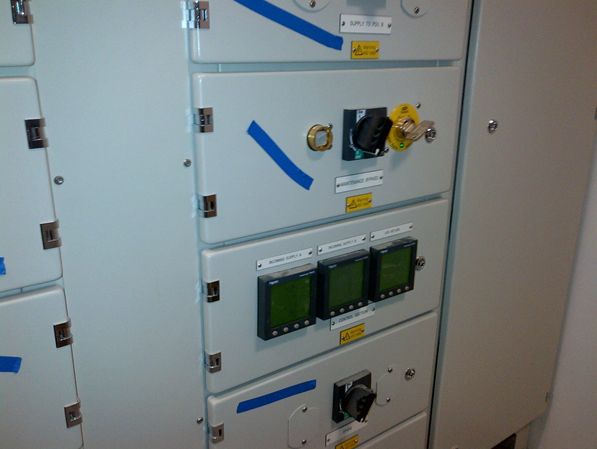Electrical panel with switches and three monitoring displays