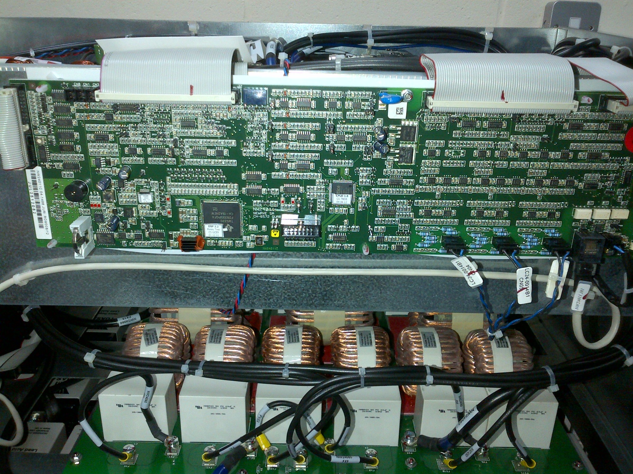 Control circuit board, ribbon cables and internal components exposed for service access.