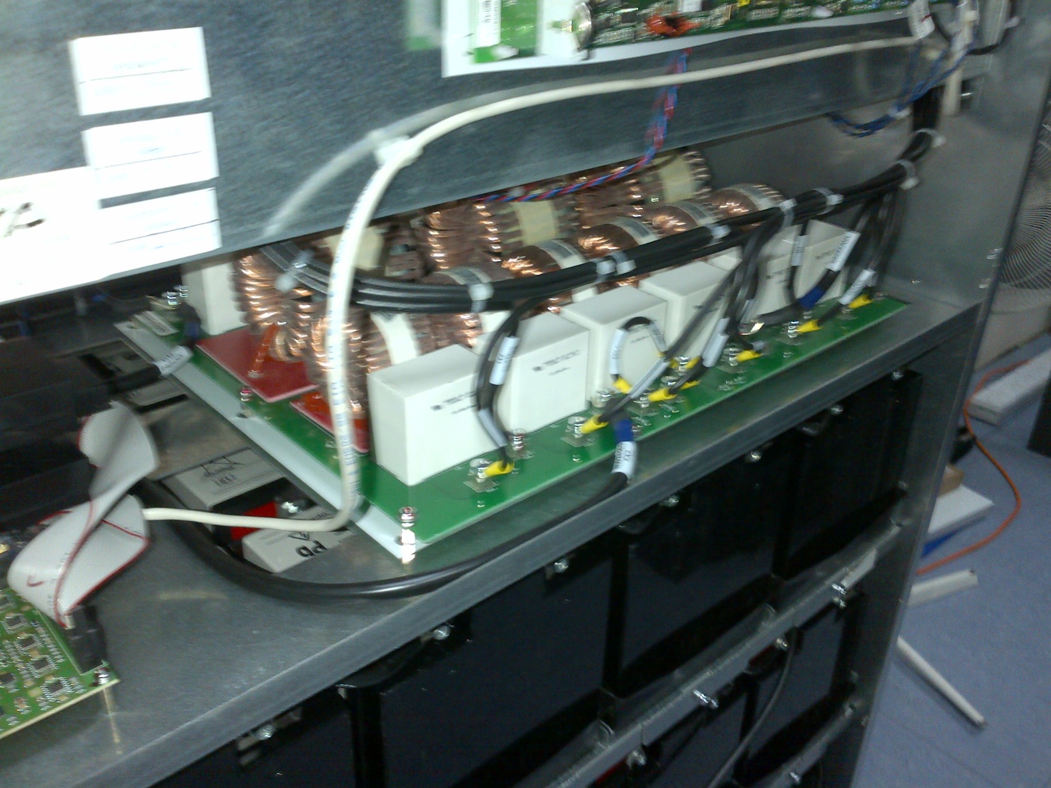 A view of UPS power components and cabling during an on-site maintenance visit.